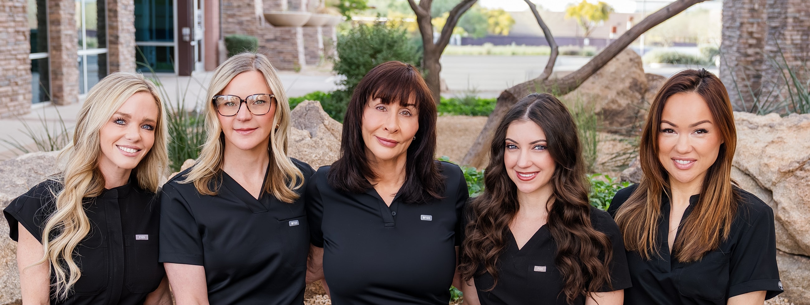 Blume med spa Scottsdale providers standing in front of office smiling.